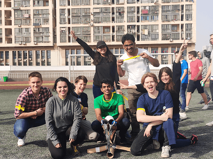 Raj with a team outdoors